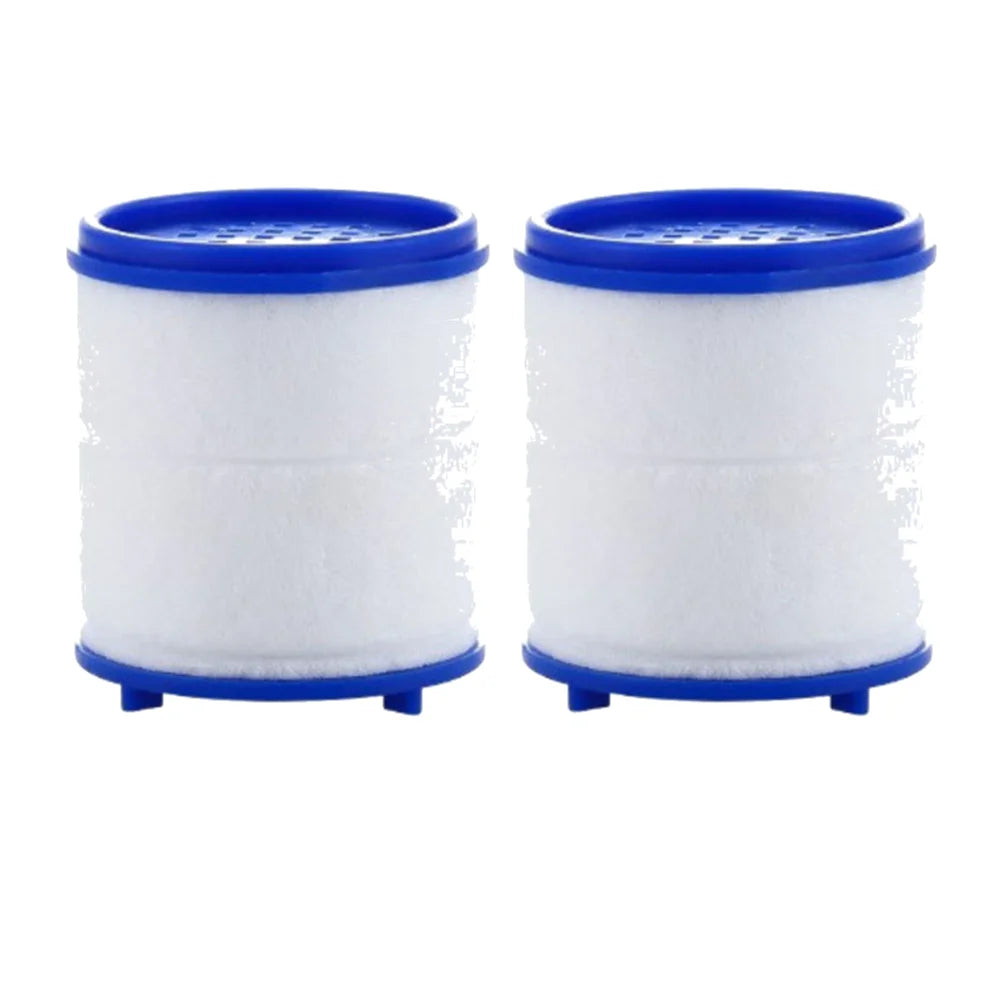 Two white foam water filters with blue caps and splash guards for a kitchen faucet.