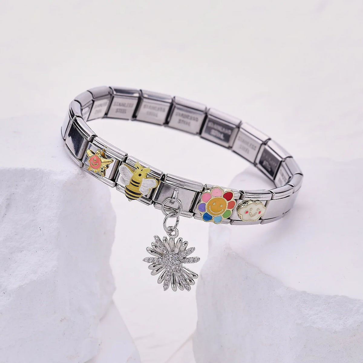 Silver Western Cowboy charm bracelet with various animal and floral charms displayed on a white surface.