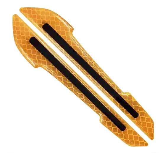 A set of reflective safety strips for a car mirror, featuring an orange honeycomb pattern and black strips.