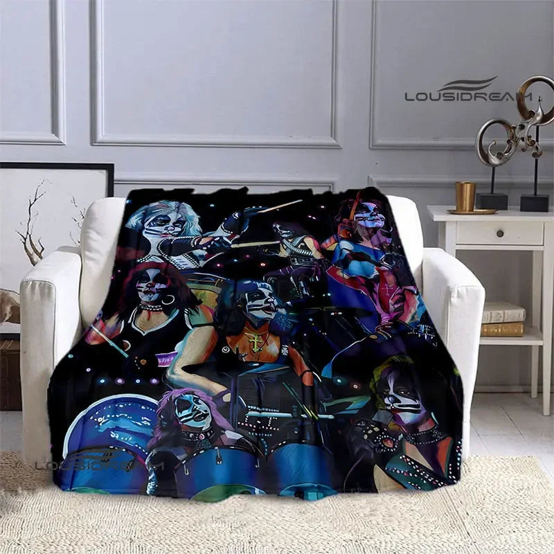 A black and blue printed flannel throw blanket featuring various stylized band imagery.