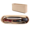 A tan felt purse organizer insert with a zipper is shown, featuring compartments for various small items.