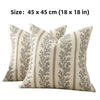 A cream-colored throw pillow cover with a gray floral pattern and vertical stripes.