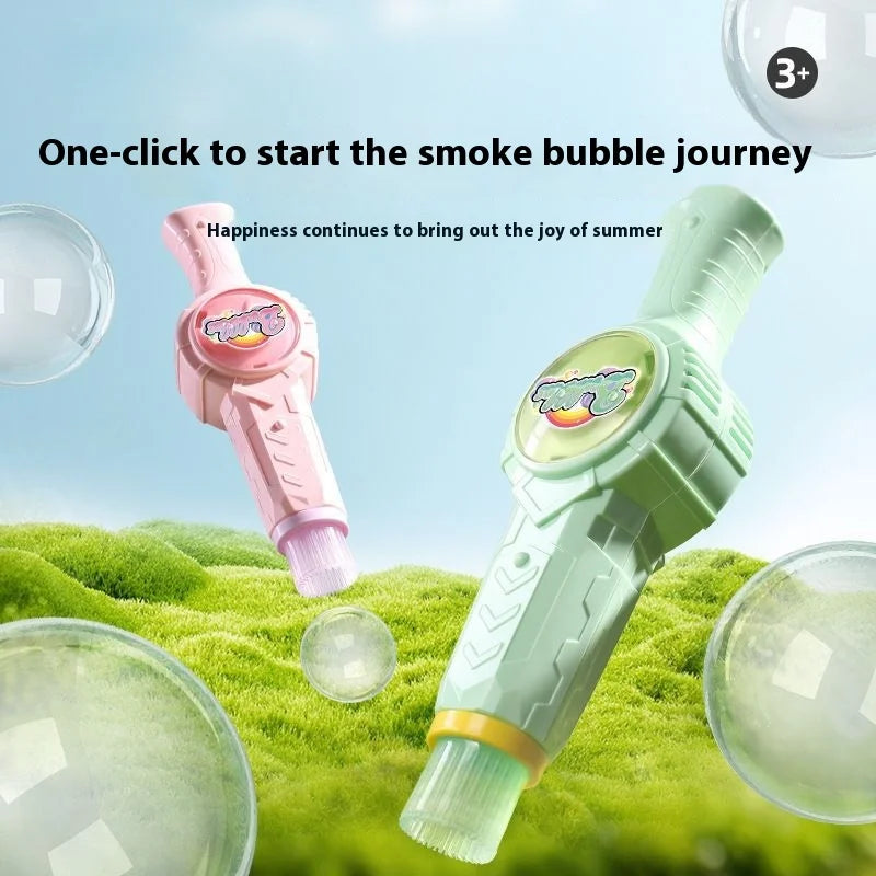 A pink and green magic smoke bubble machine is shown blowing bubbles over green grass.