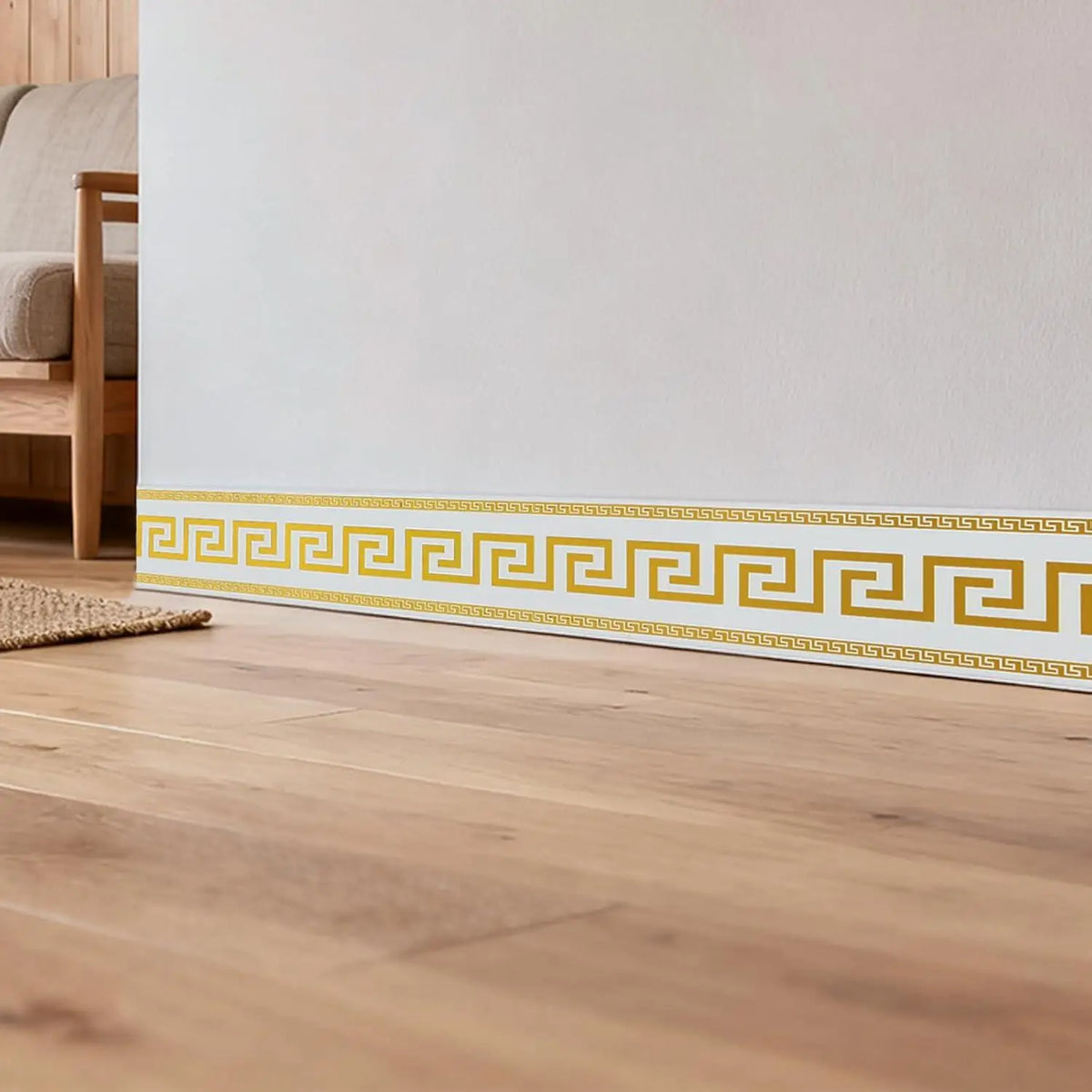 A decorative yellow and white geometric border trim applied to a light wood floor.