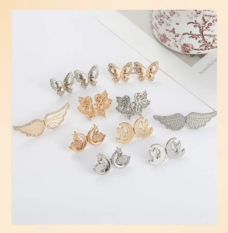 A collection of gold and silver no-sew adjustable waist tighteners for jeans and skirts.
