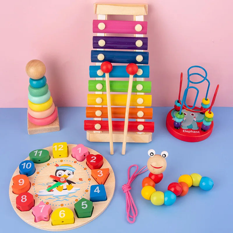 A set of colorful wooden puzzles and stacking toys including a tower, puzzle pieces, and an elephant figure.
