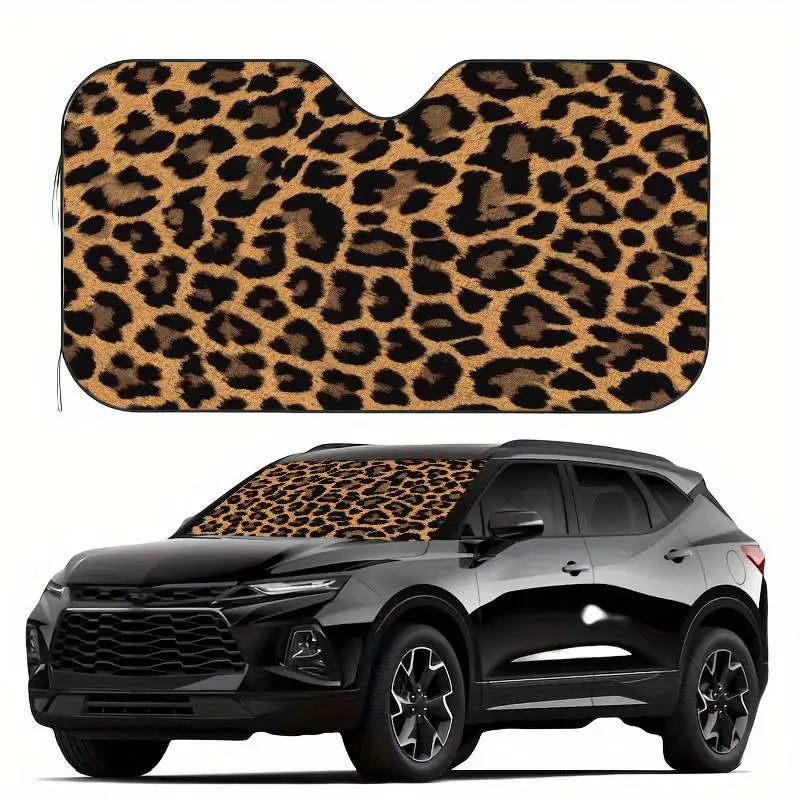 A leopard print car windshield sunshade is shown on a black SUV.