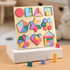 A wooden rainbow shape puzzle featuring colorful geometric shapes arranged on a light background.