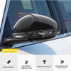 Gloss black carbon look mirror covers installed on a car window.