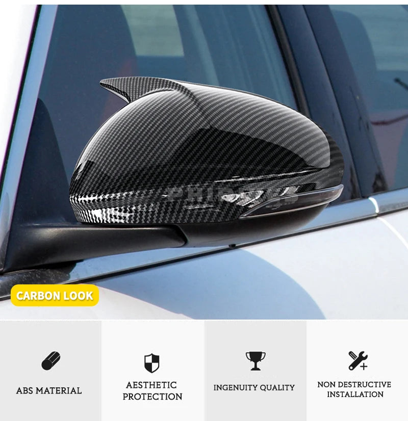 Gloss black carbon look mirror covers installed on a car window.