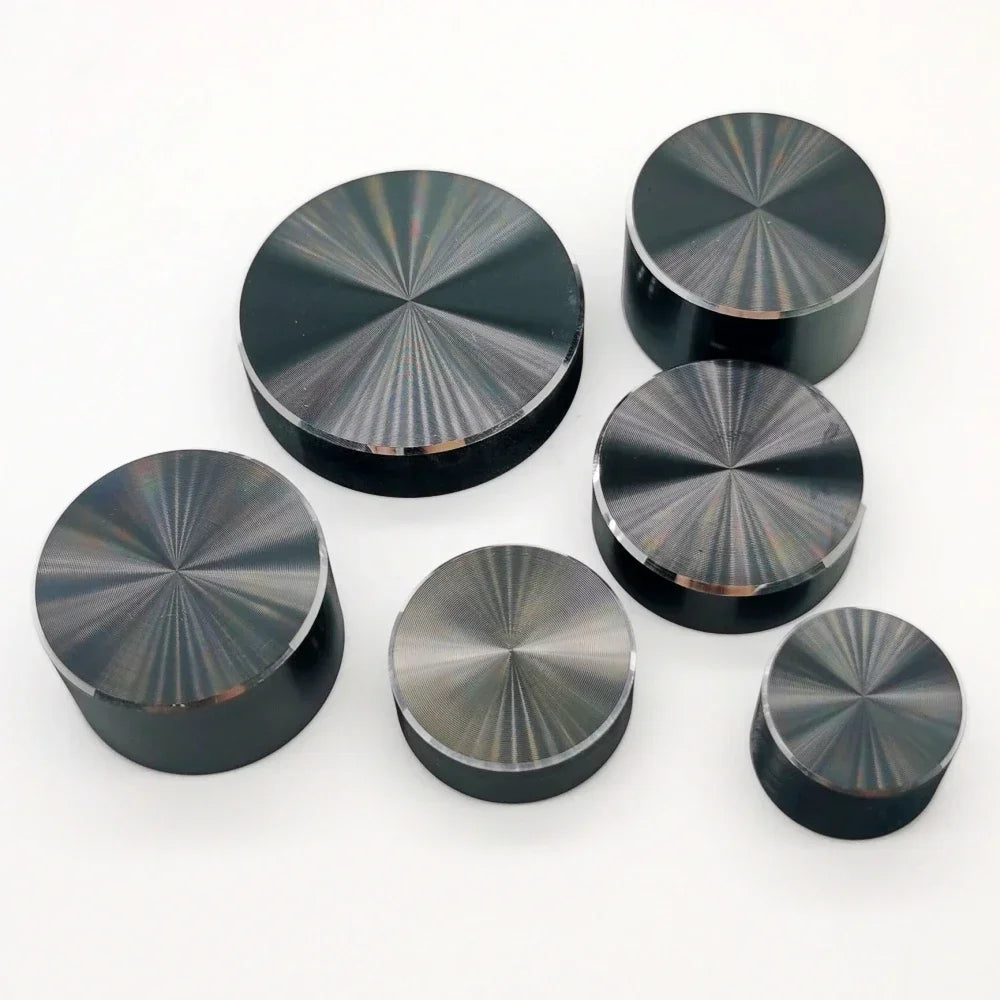 A collection of black aluminum knurled knobs used for 6mm shaft potentiometers and encoders.