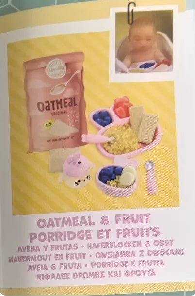 A package of oatmeal and fruit porridge ingredients with miniature food accessories for a doll kit