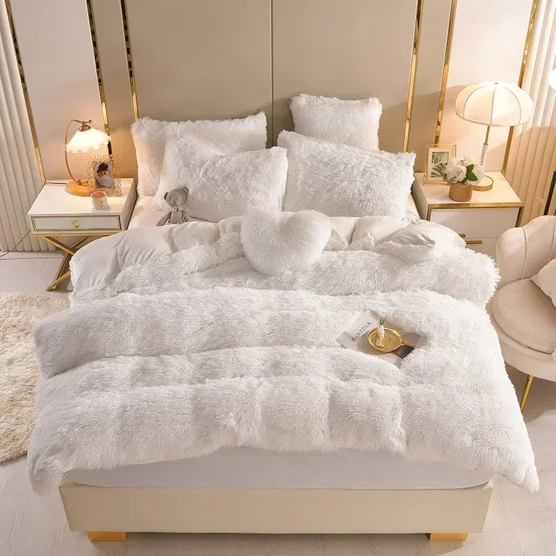 A luxurious white plush mink velvet duvet cover set displayed on a bed with matching pillows and bedside tables.