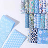 A collection of 40 floral cotton fabric strips in various patterns and colors for quilting and patchwork.