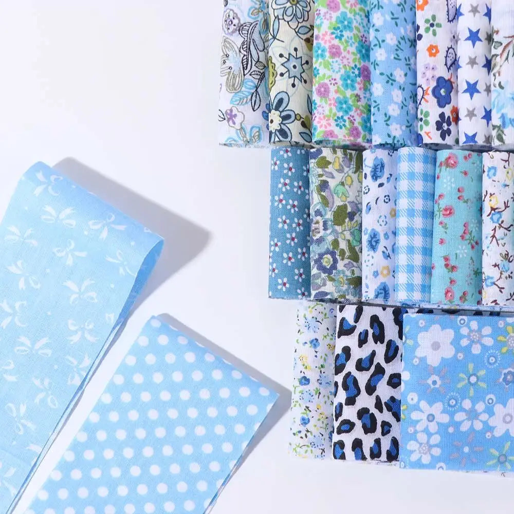 A collection of 40 floral cotton fabric strips in various patterns and colors for quilting and patchwork.