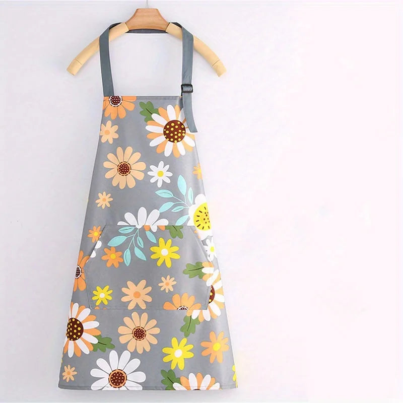 Gray floral print kitchen apron with adjustable neck strap and pockets hanging on a wooden hanger