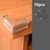 Ten silicone corner edge guards in a translucent amber color used for baby safety on wooden furniture.