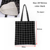 Black plaid canvas tote bag with light beige lining and black handles