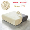 A beige velvet fabric sofa cover displayed on a gray cushion, showing the texture and drape of the fabric.