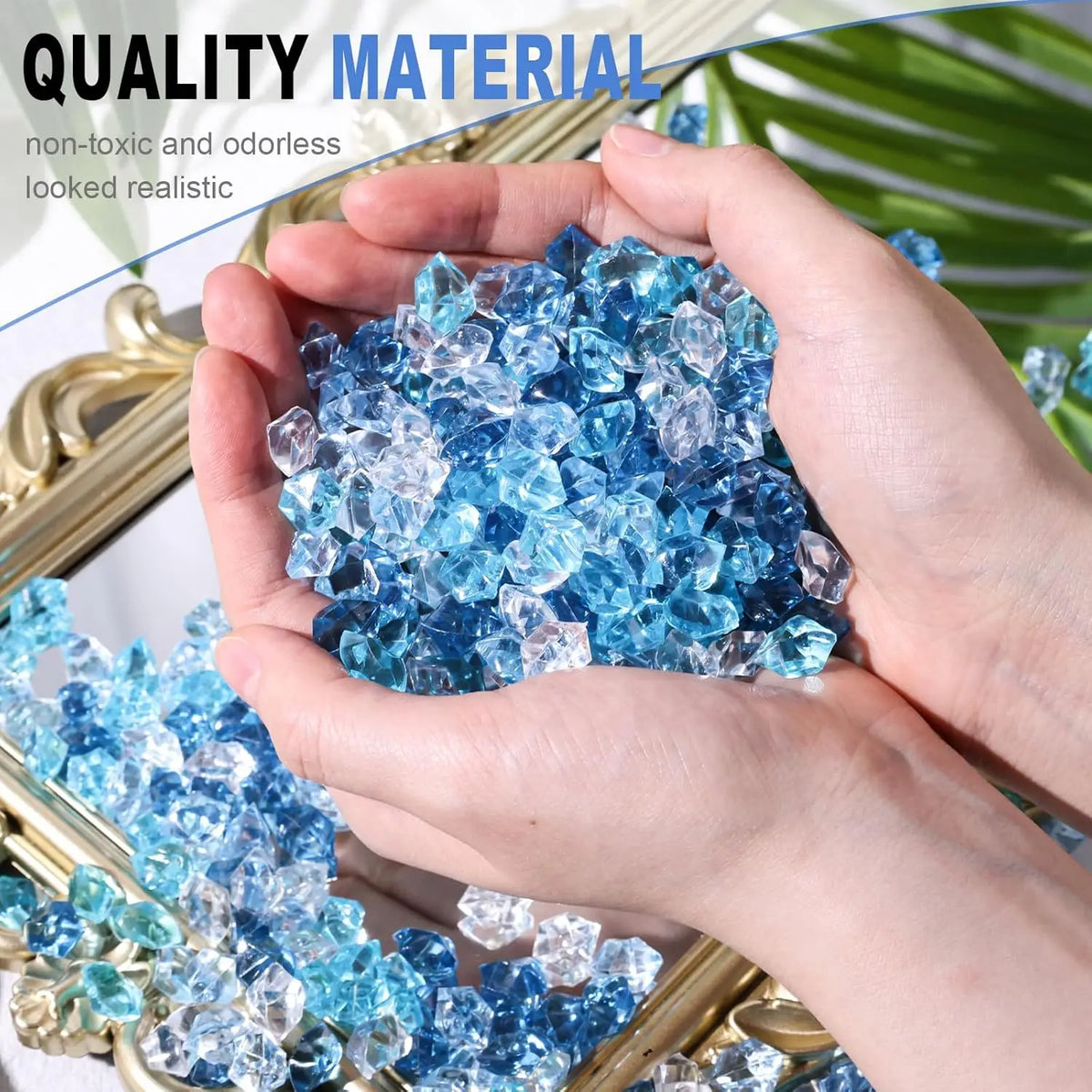 Hands hold crushed blue acrylic ice gems for vase fillers and decor