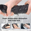 Hands dipping a black microfiber cloth into water, demonstrating strong water absorption and water lock.