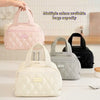 A collection of quilted PU leather insulated lunch totes in pink, gray, and black are displayed on a white surface.