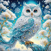 A detailed painting of a majestic owl with blue and white feathers adorned with sparkling crystals against a bright sky.