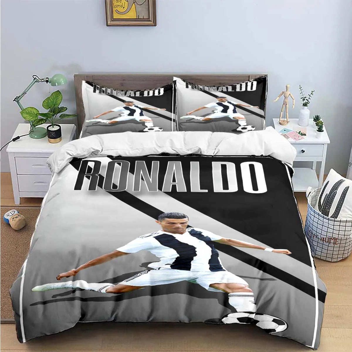 A black and white graphic duvet cover featuring a soccer player in action.