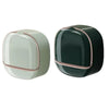 A waterproof hanging soap holder with drainage in a matte light green and black finish.