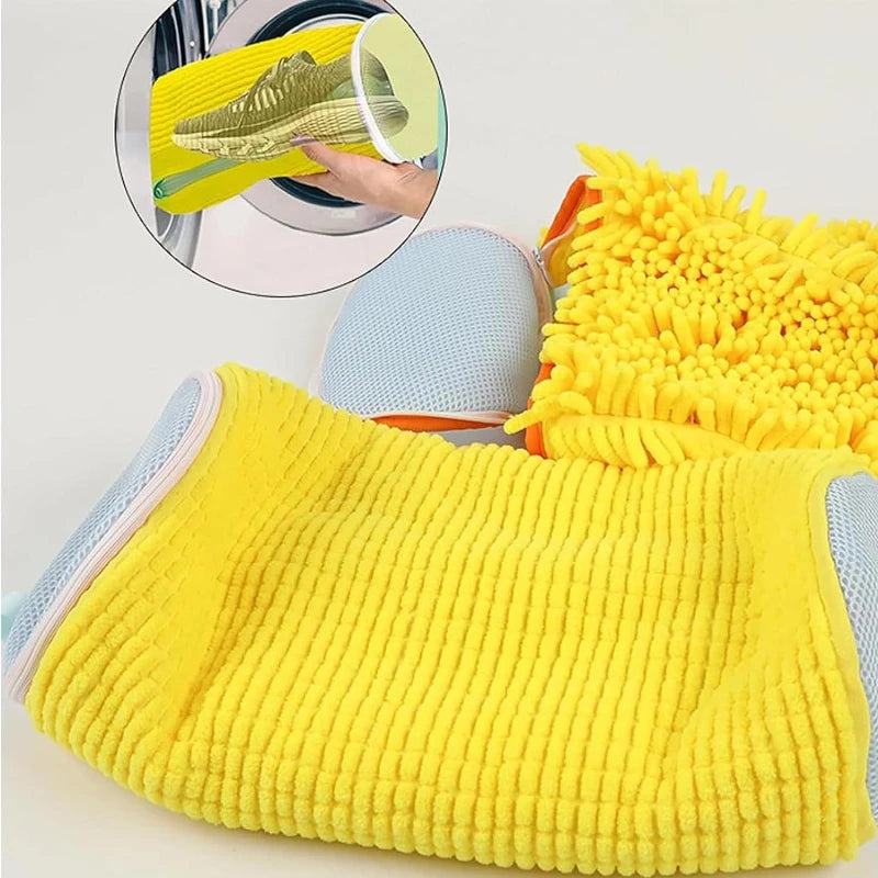 Yellow knitted reusable mesh shoe washing bag with a yellow fluffy cleaning cloth visible in the background.