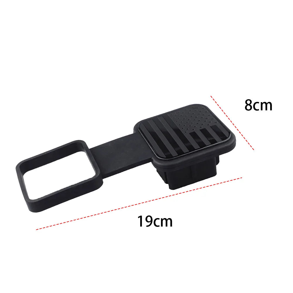 Black trailer hitch receiver cover with a flag emblem, measuring 19cm long and 8cm wide.
