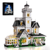 A detailed model of a Victorian house building kit featuring white and black architectural elements.