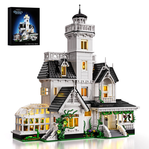 A detailed model of a Victorian house building kit featuring white and black architectural elements.