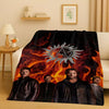 A dark blanket featuring a fiery sun emblem and portraits of characters from the Supernatural TV show