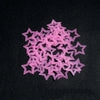 A pile of pink glow-in-the-dark 3D star wall stickers for kids' rooms and bedrooms.