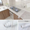Rolls of white marble effect self-adhesive PVC film used for countertops and cabinets