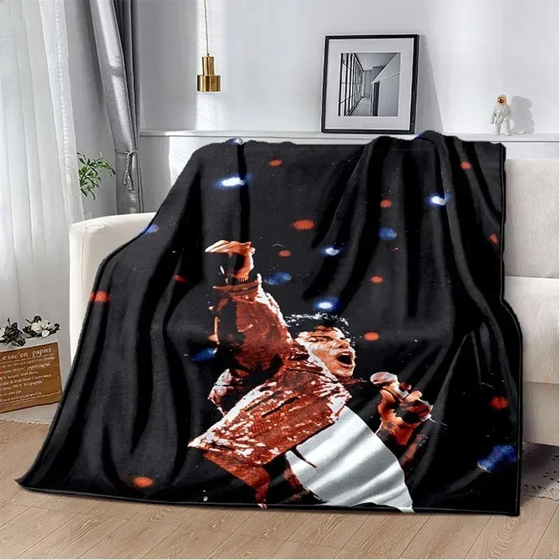 A black flannel throw blanket featuring a print of Michael Jackson performing.