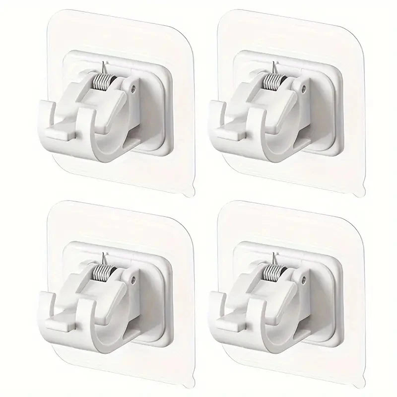Four white adhesive curtain rod hooks in various sizes mounted on a clear wall plate.