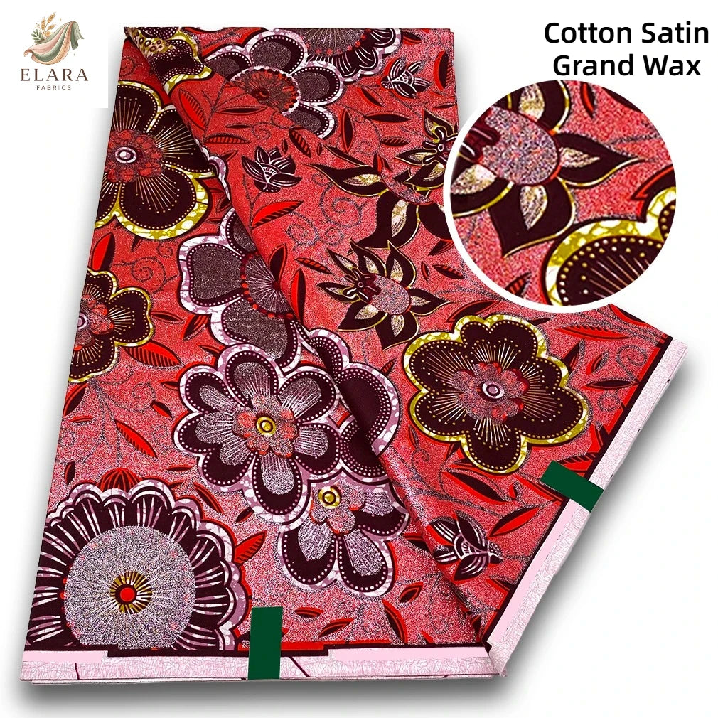 Red and pink cotton satin grand wax fabric featuring floral patterns with glitter accents