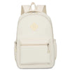 A cream-colored urban nylon backpack with a flap closure and zippered pockets.