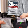 A stack of gray triple-layer microfiber scouring cloths is shown next to a used cloth on a black dishwashing pad.