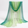 Green and teal sheer fabric playsilk curtains draped for imaginative play