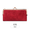 A red leather wallet with a gold-toned clasp and a metallic trim.