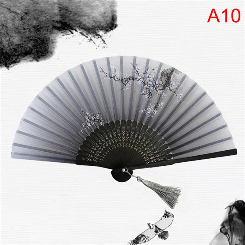 A folding fan with a gray and black striped design featuring delicate floral patterns, shown open against a white background.