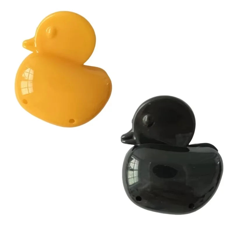 A pair of yellow and black silicone toothbrush head covers with clips.