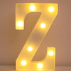 A glowing yellow LED letter Z night light displayed against a white background.