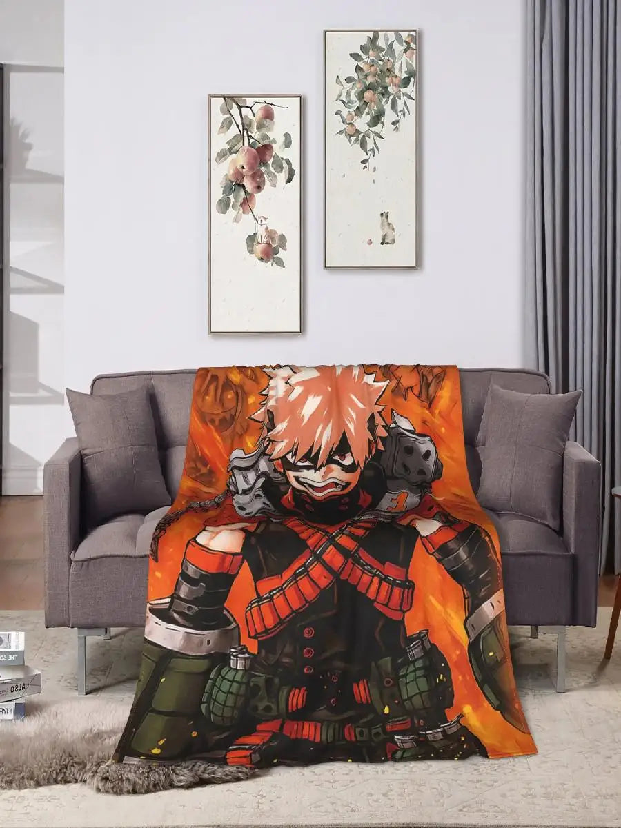 An orange and black themed throw blanket featuring a character from My Hero Academia