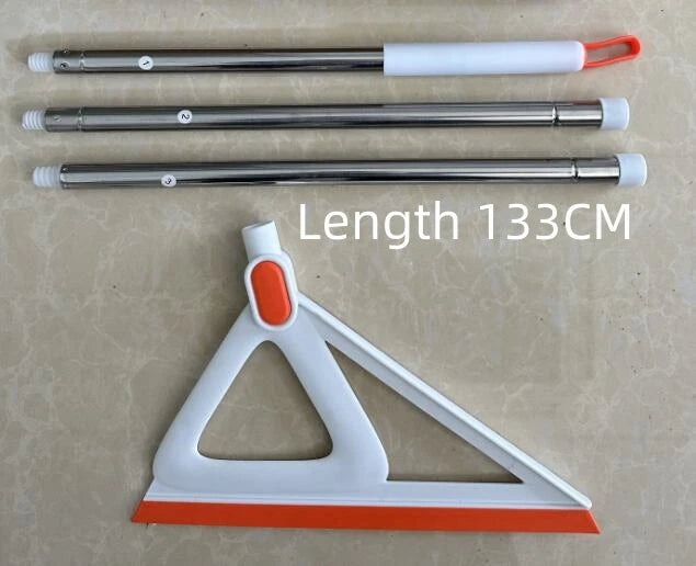 A silicone squeegee broom with a white handle and orange bristles is shown alongside its disassembled parts.