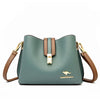 A light sage green women's three-layer leather shoulder bag with gold hardware and a brown crossbody strap.