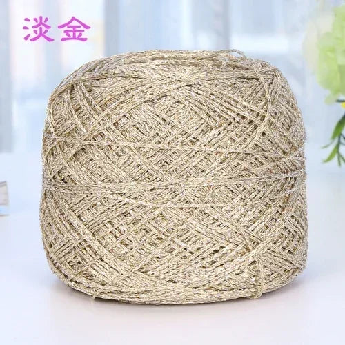 A ball of metallic silver shimmer crochet yarn used for knitting and macrame.